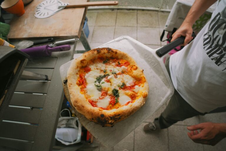 a pizza sitting on top of a piece of paper